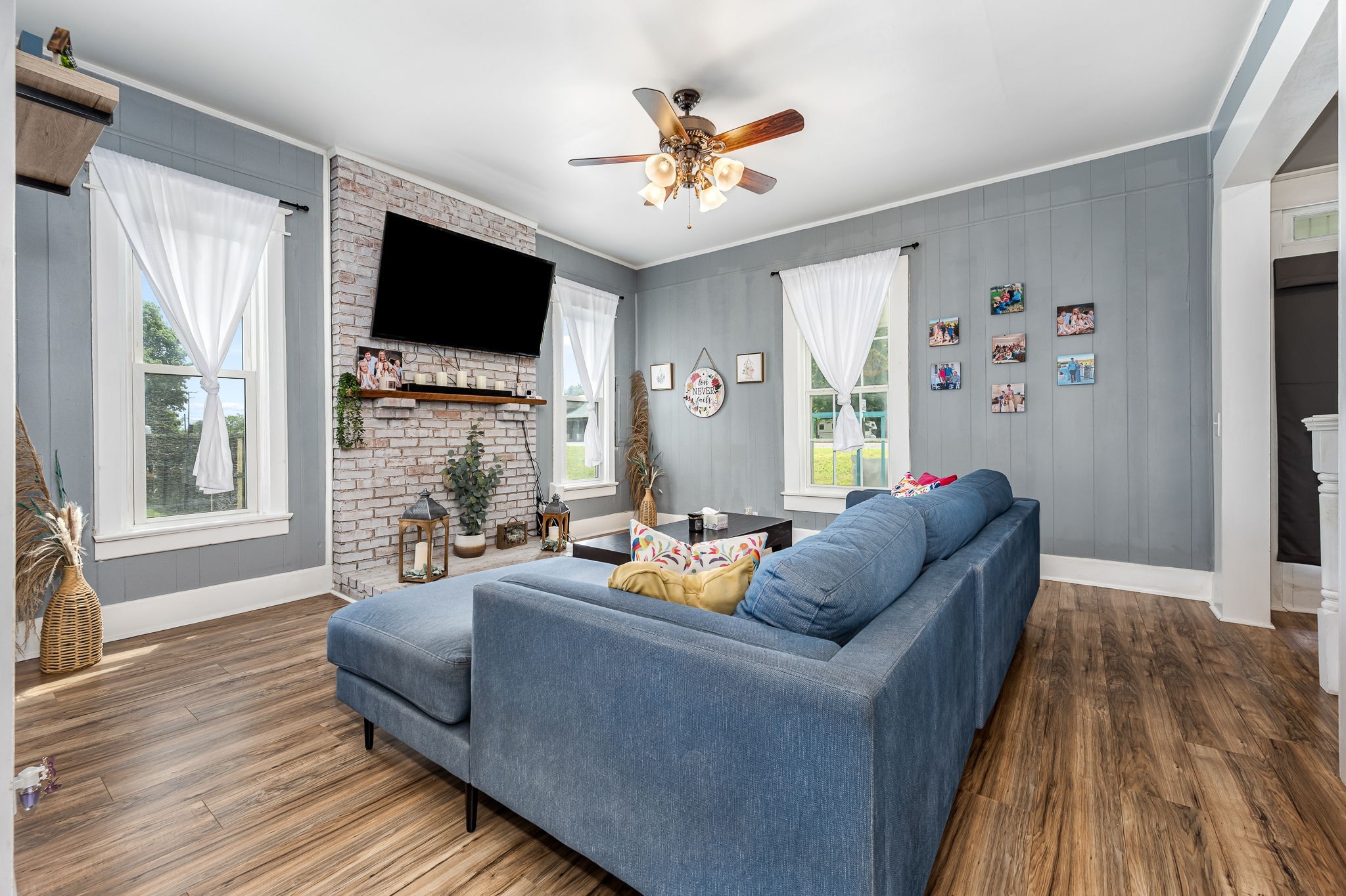 634 Highway 52 Portland, TN 37148 - Photo 10 of 42 a living room with fireplace furniture and a flat screen tv