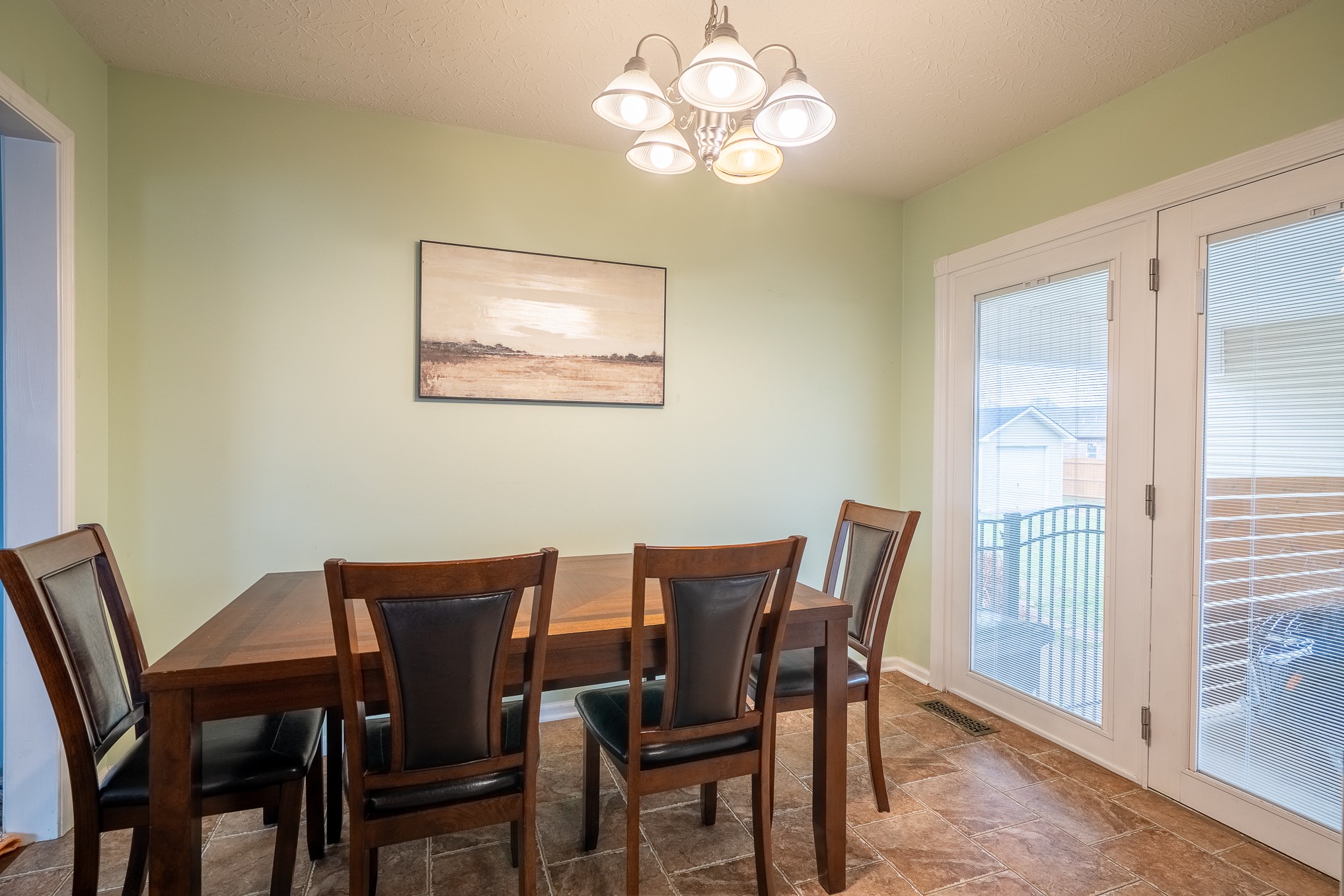 110 Kitty Meyer Lane Loretto, TN 38469 - Photo 15 of 27 a view of a dining room with furniture wooden floor and a chandelier