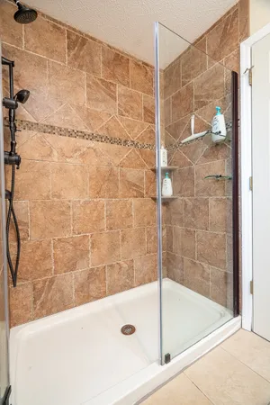 a bathroom with a bathtub and a shower