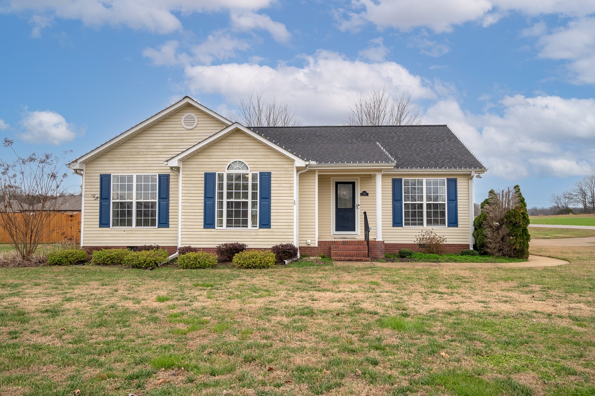 110 Kitty Meyer Lane Loretto, TN 38469 - Photo 3 of 27 a front view of a house with a garden