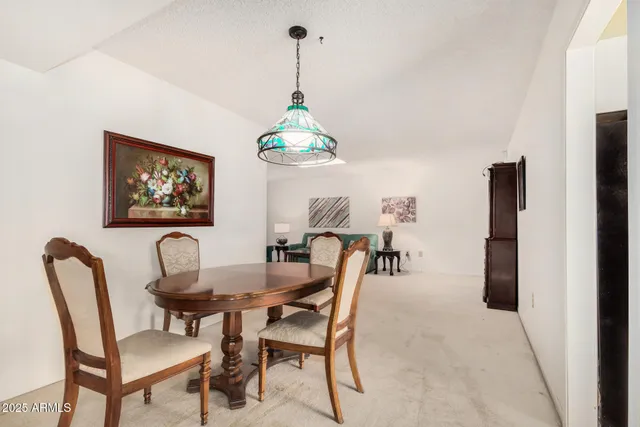 a dining room with furniture and window