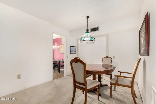 a dining room with furniture and window