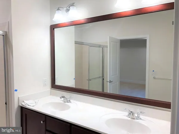 a bathroom with a vanity and a mirror