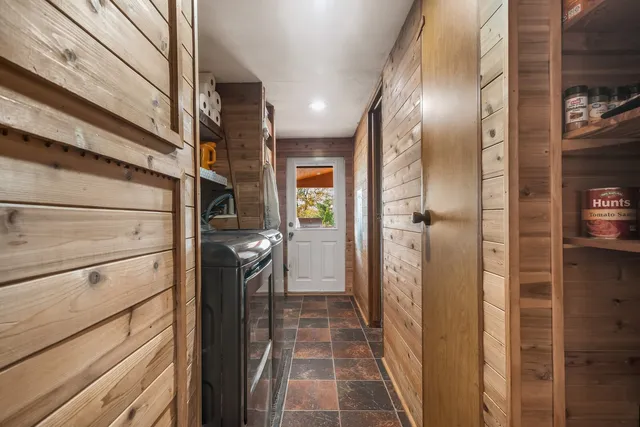a bathroom with a glass shower door