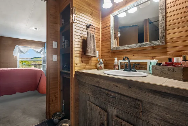a bathroom with a sink and a mirror