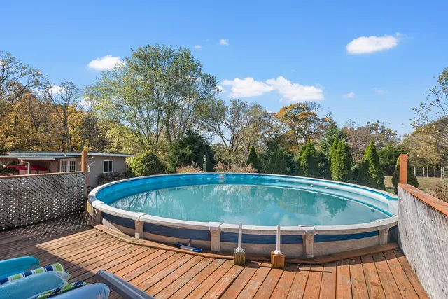 a view of balcony with wooden floor