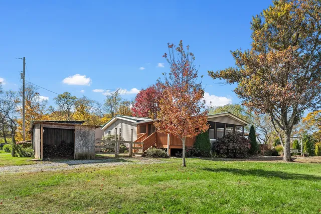 a view of a house with a big yard