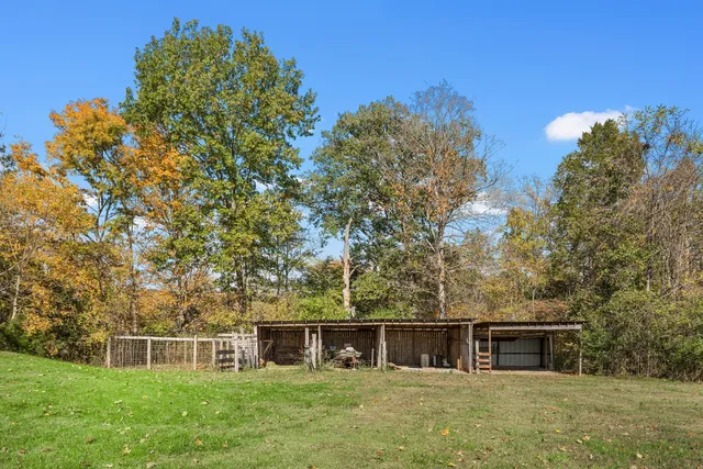 a view of a car park in front of house