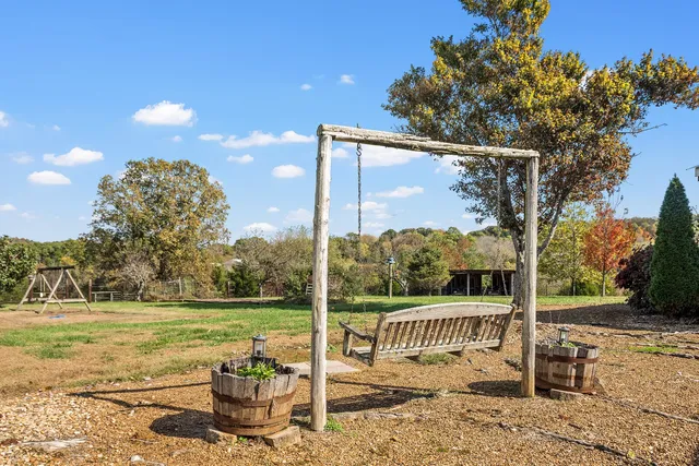 a view of a pathway of a house with a yard