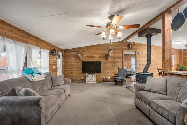 a living room with furniture and large flat screen tv