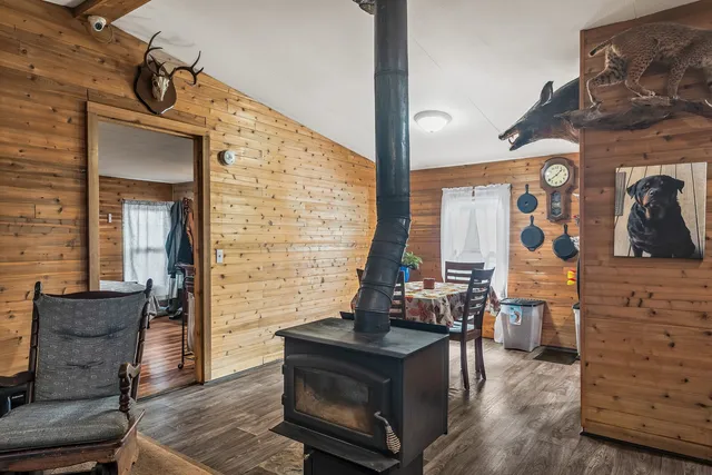 a view of living room with furniture and wooden floor