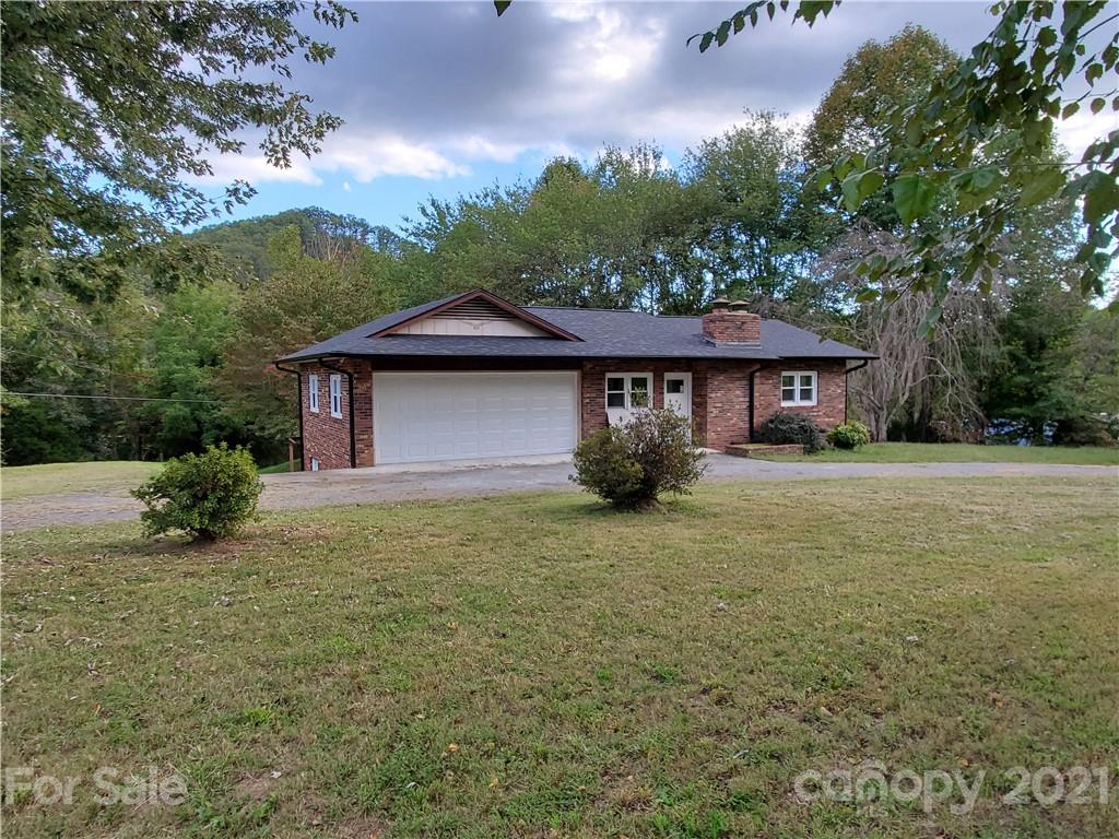 536 Fairview Road Marion, NC 28752 - Photo 1 of 34 a front view of a house with garden