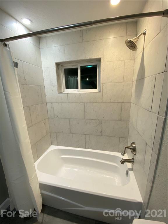 536 Fairview Road Marion, NC 28752 - Photo 12 of 34 a bathroom with a bathtub and shower