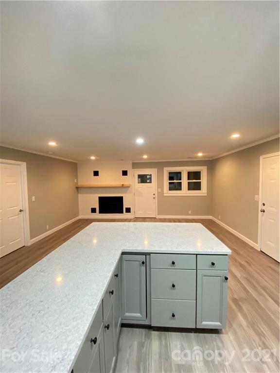 536 Fairview Road Marion, NC 28752 - Photo 13 of 34 a spacious bathroom with a granite countertop sink and a bathtub