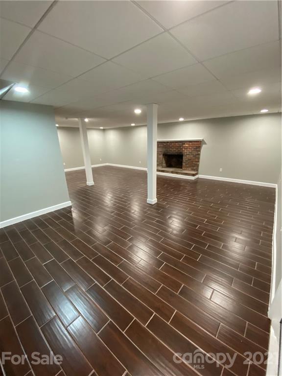 536 Fairview Road Marion, NC 28752 - Photo 14 of 34 a view of empty room with wooden floor