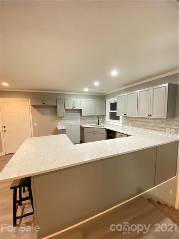 536 Fairview Road Marion, NC 28752 - Photo 4 of 34 a large white kitchen with a large window