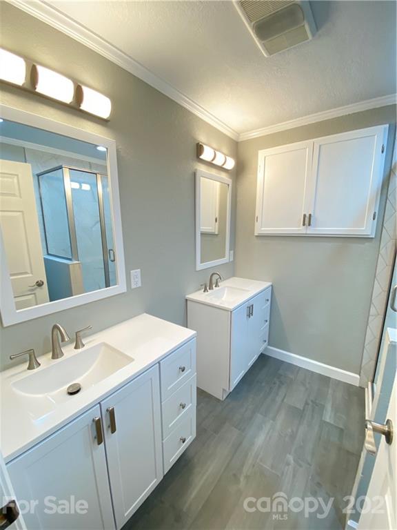 536 Fairview Road Marion, NC 28752 - Photo 7 of 34 a view of bathroom with double vanity sink and mirror