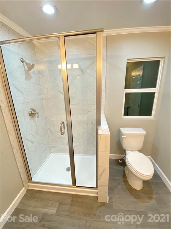 536 Fairview Road Marion, NC 28752 - Photo 8 of 34 a bathroom with a toilet and a shower
