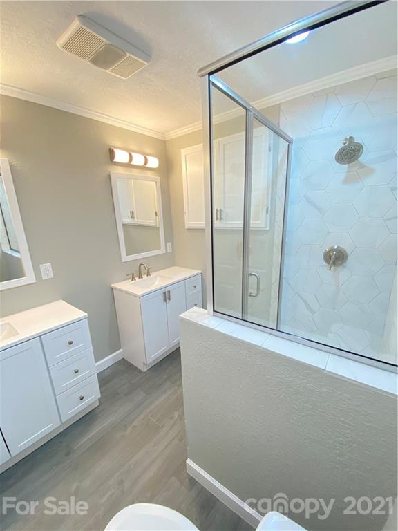 536 Fairview Road Marion, NC 28752 - Photo 9 of 34 a bathroom with a bathtub sink mirror and toilet