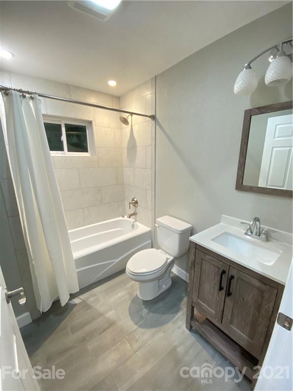 536 Fairview Road Marion, NC 28752 - Photo 10 of 34 a bathroom with a sink a toilet and shower
