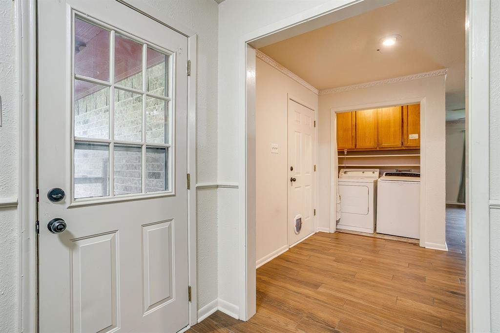 709 North Ave B Springtown, TX 76082 - Photo 28 of 32 a view of empty room with wooden floor and windows