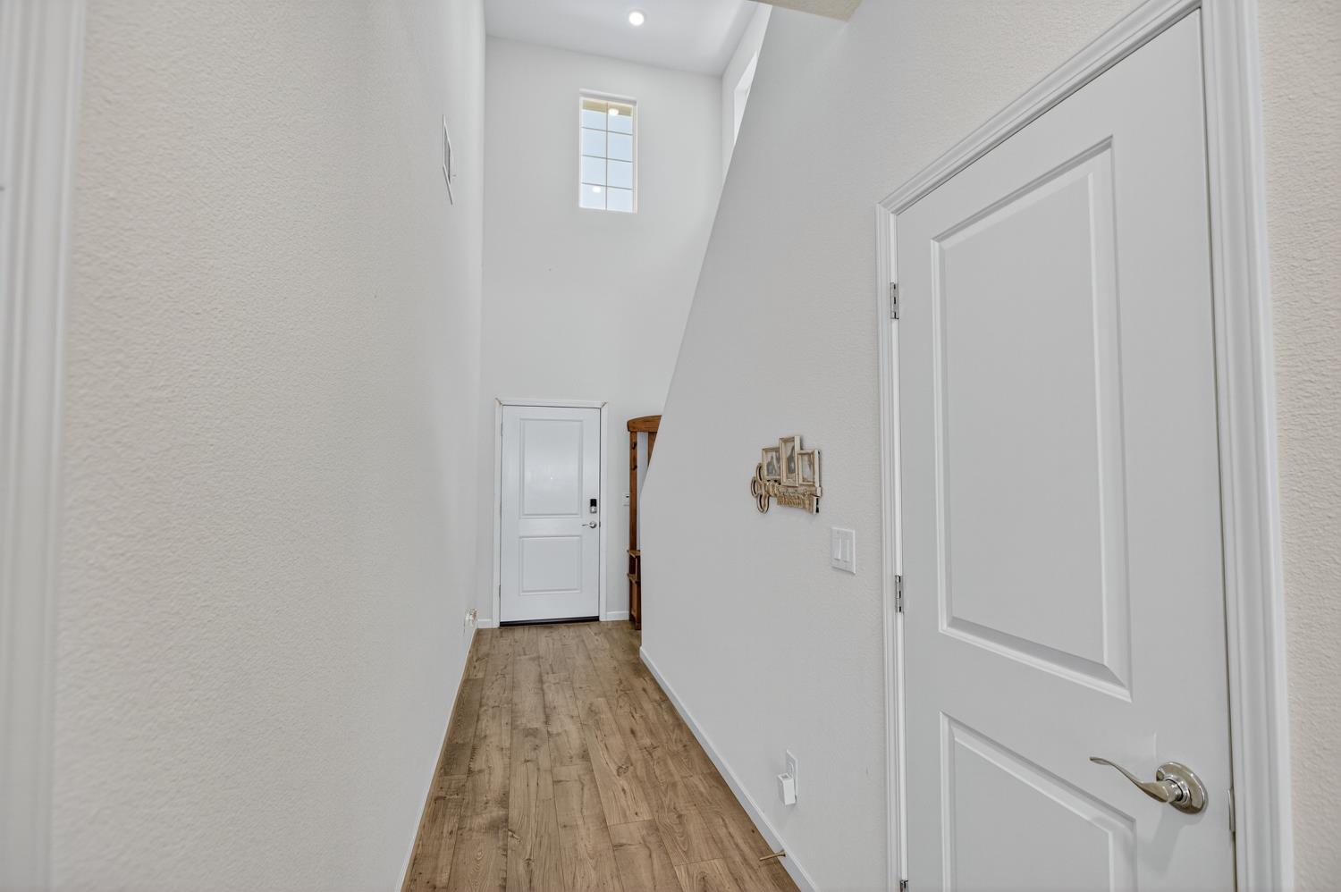 11786 Socrates Way Rancho Cordova, CA 95742 - Photo 12 of 48 a view of a hallway with wooden floor and entryway