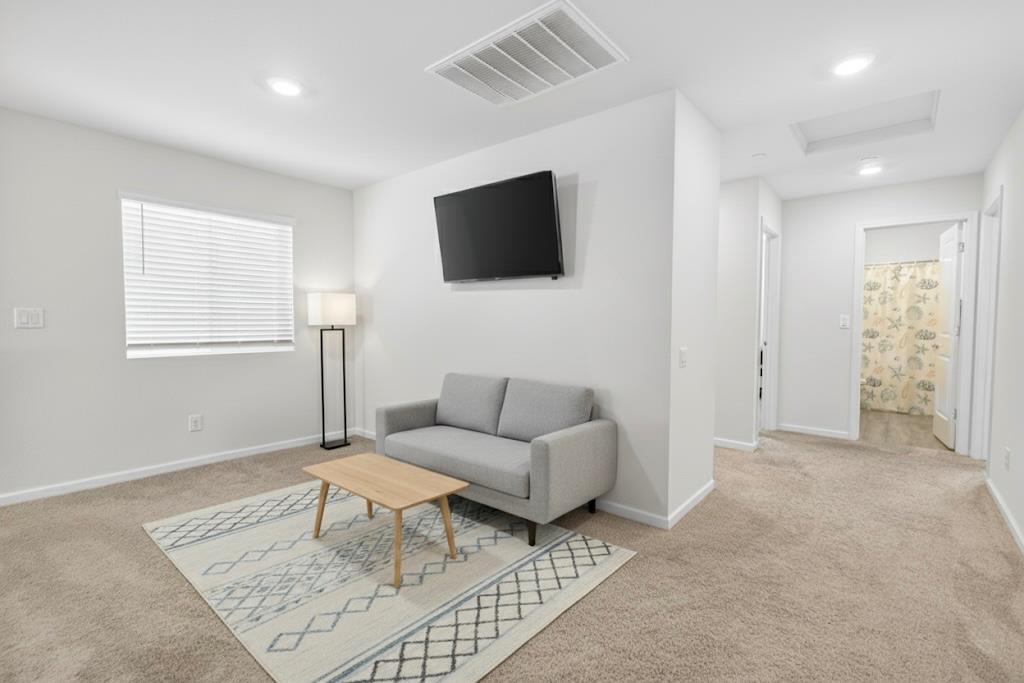 11786 Socrates Way Rancho Cordova, CA 95742 - Photo 13 of 48 a living room with furniture and a flat screen tv