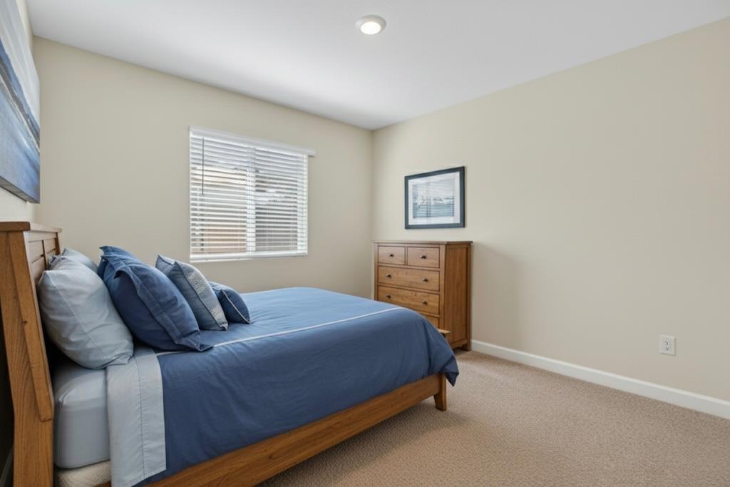11786 Socrates Way Rancho Cordova, CA 95742 - Photo 14 of 48 a bedroom with a bed and a window