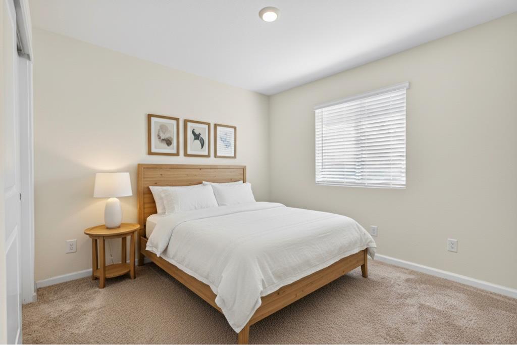 11786 Socrates Way Rancho Cordova, CA 95742 - Photo 18 of 48 a large bed sitting in a bedroom next to a lamp