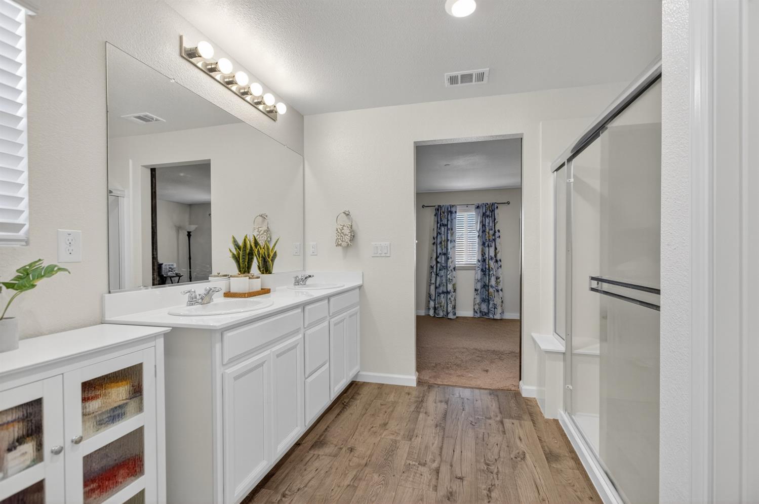 11786 Socrates Way Rancho Cordova, CA 95742 - Photo 22 of 48 a bathroom with a sink a toilet and shower