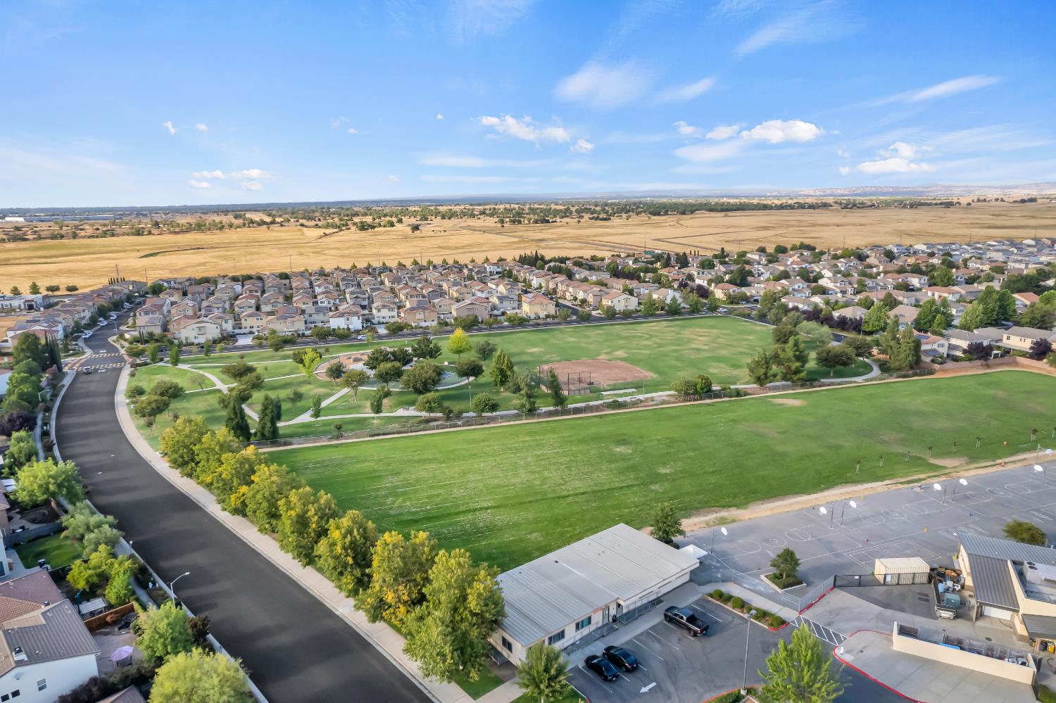 11786 Socrates Way Rancho Cordova, CA 95742 - Photo 33 of 48 an aerial view of a house with a garden and lake view