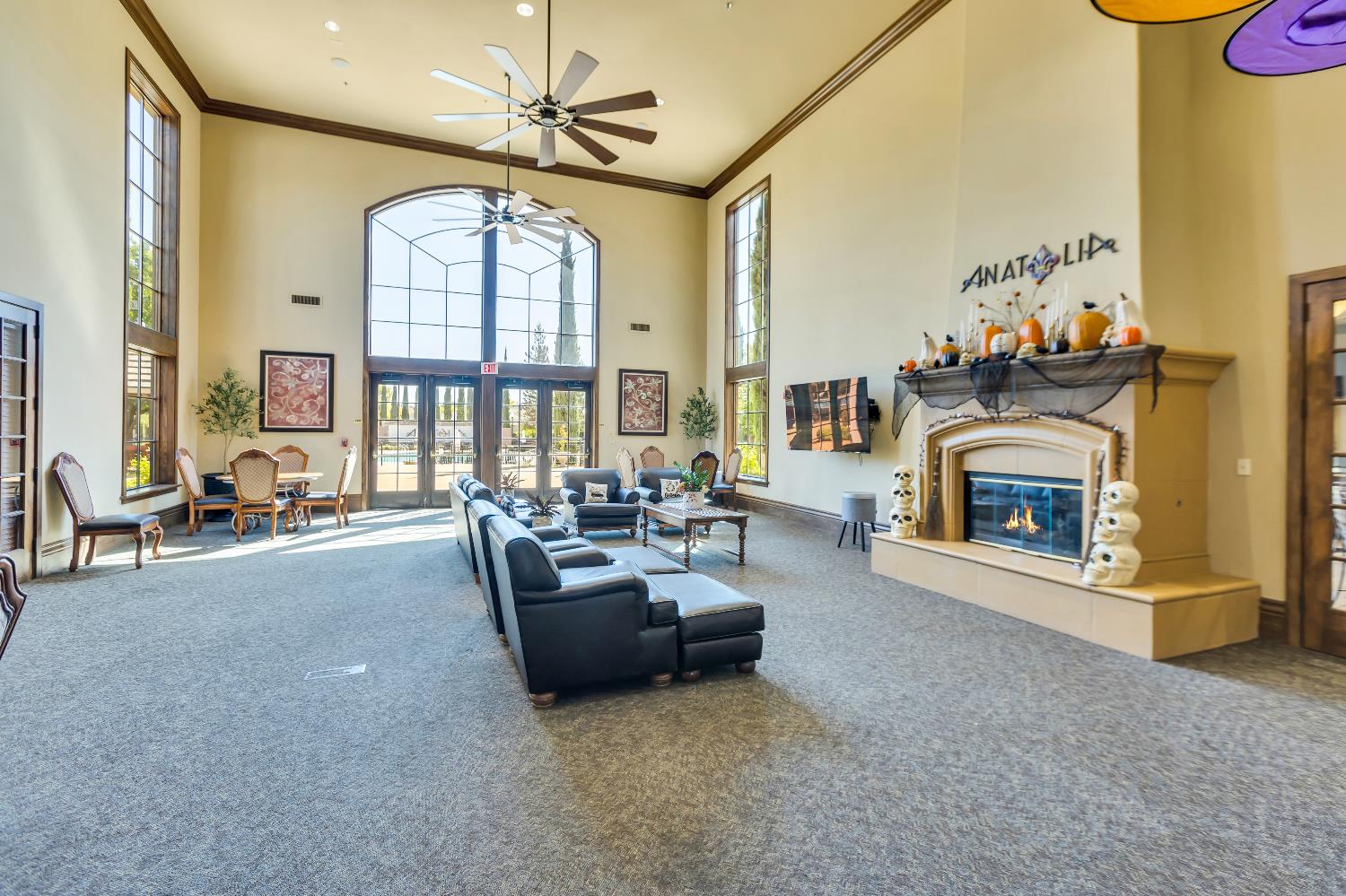 11786 Socrates Way Rancho Cordova, CA 95742 - Photo 39 of 48 a living room with furniture a fireplace and a chandelier