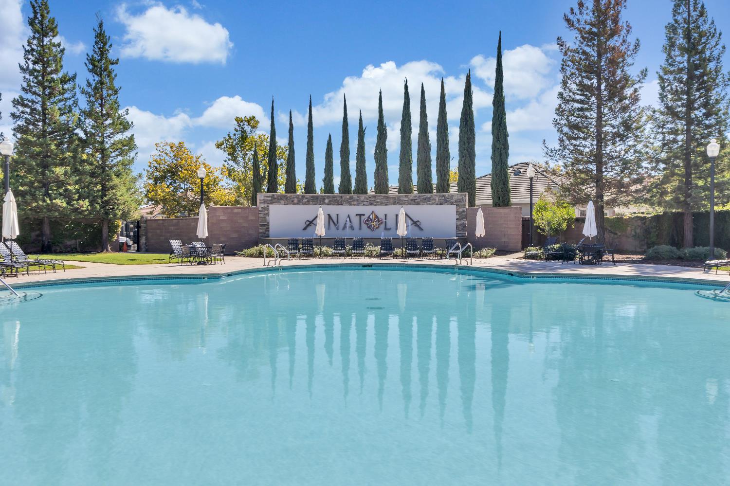 11786 Socrates Way Rancho Cordova, CA 95742 - Photo 41 of 48 a view of a lake with a building in the background