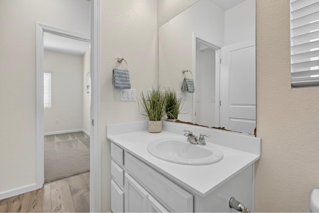 11786 Socrates Way Rancho Cordova, CA 95742 - Photo 9 of 48 a bathroom with a sink and a mirror