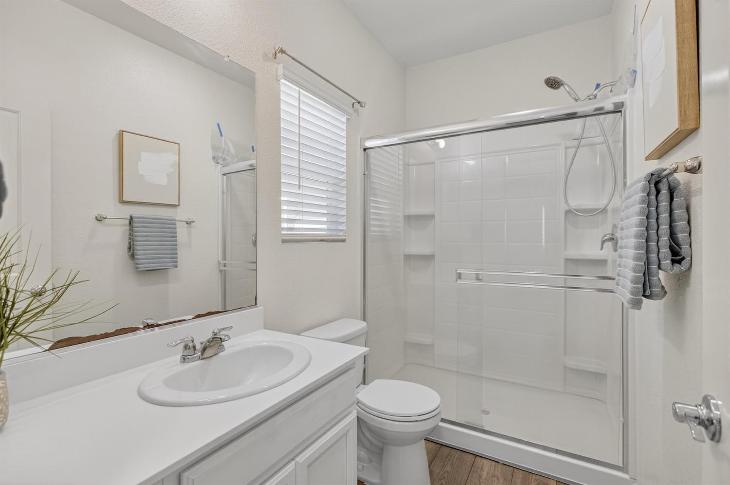 11786 Socrates Way Rancho Cordova, CA 95742 - Photo 10 of 48 a bathroom with a sink toilet and shower