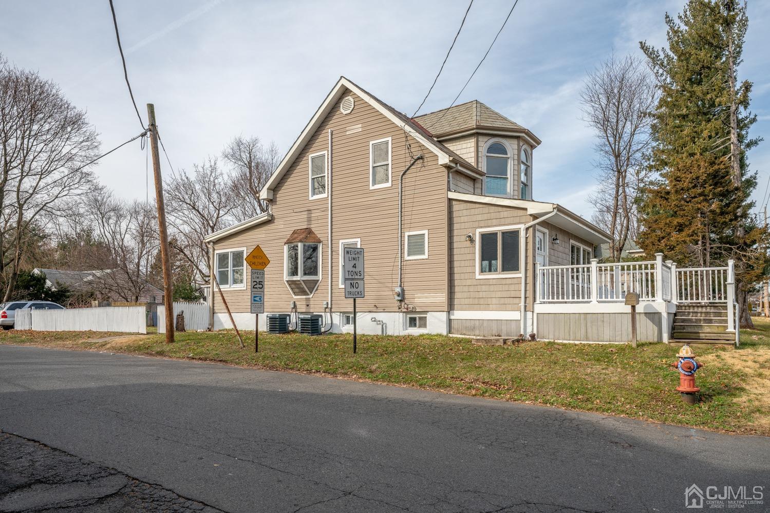 42 Meadow Road Edison, NJ 08817 - Photo 2 of 35 a front view of a house with a yard