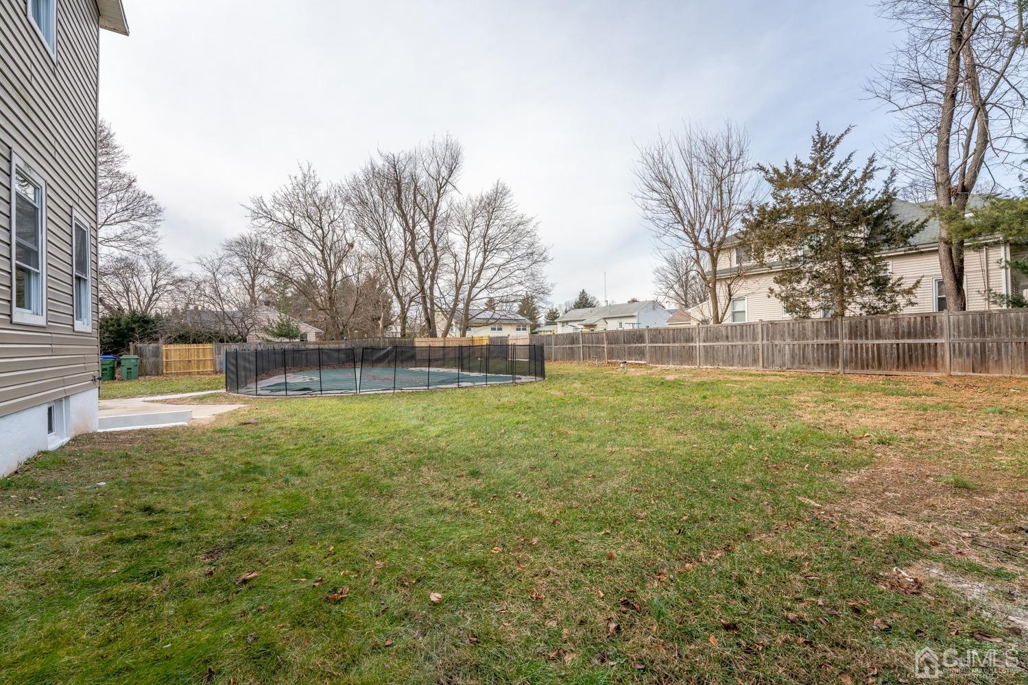 42 Meadow Road Edison, NJ 08817 - Photo 32 of 35 a view of outdoor space with deck and yard