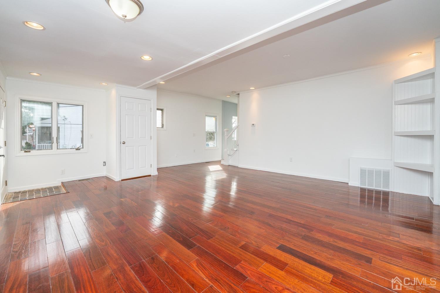 42 Meadow Road Edison, NJ 08817 - Photo 6 of 35 a view of empty room with wooden floor and fan