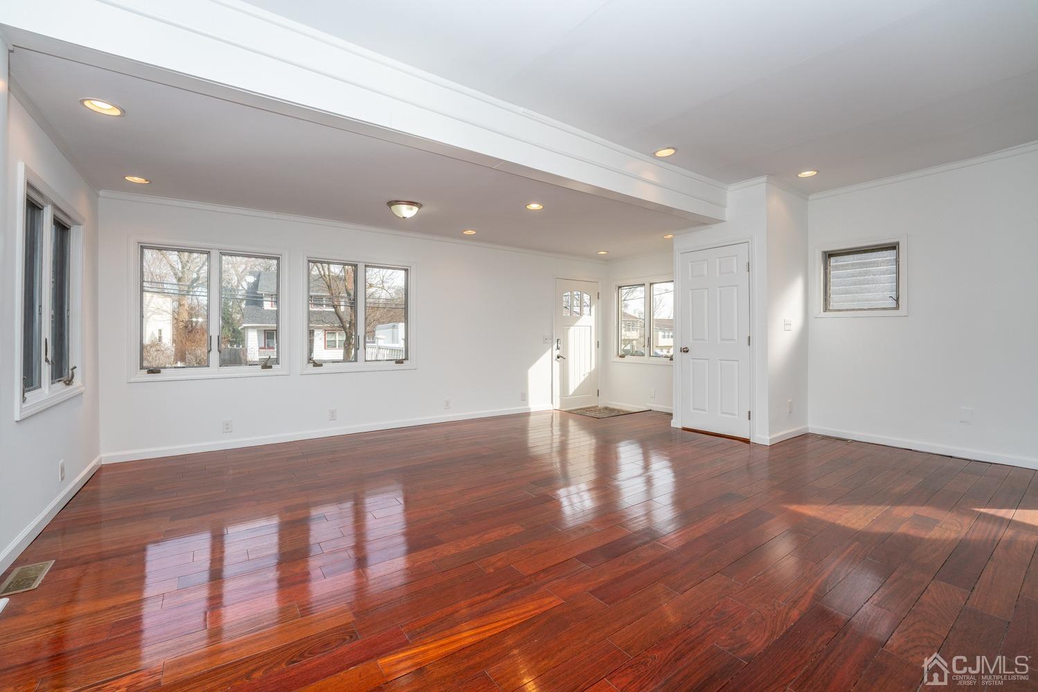 42 Meadow Road Edison, NJ 08817 - Photo 7 of 35 a view of empty room with wooden floor and fan