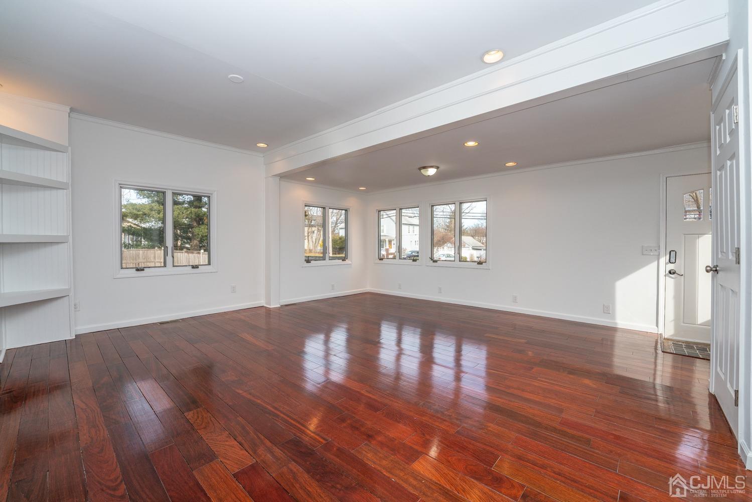 42 Meadow Road Edison, NJ 08817 - Photo 8 of 35 a view of an empty room with wooden floor and a window