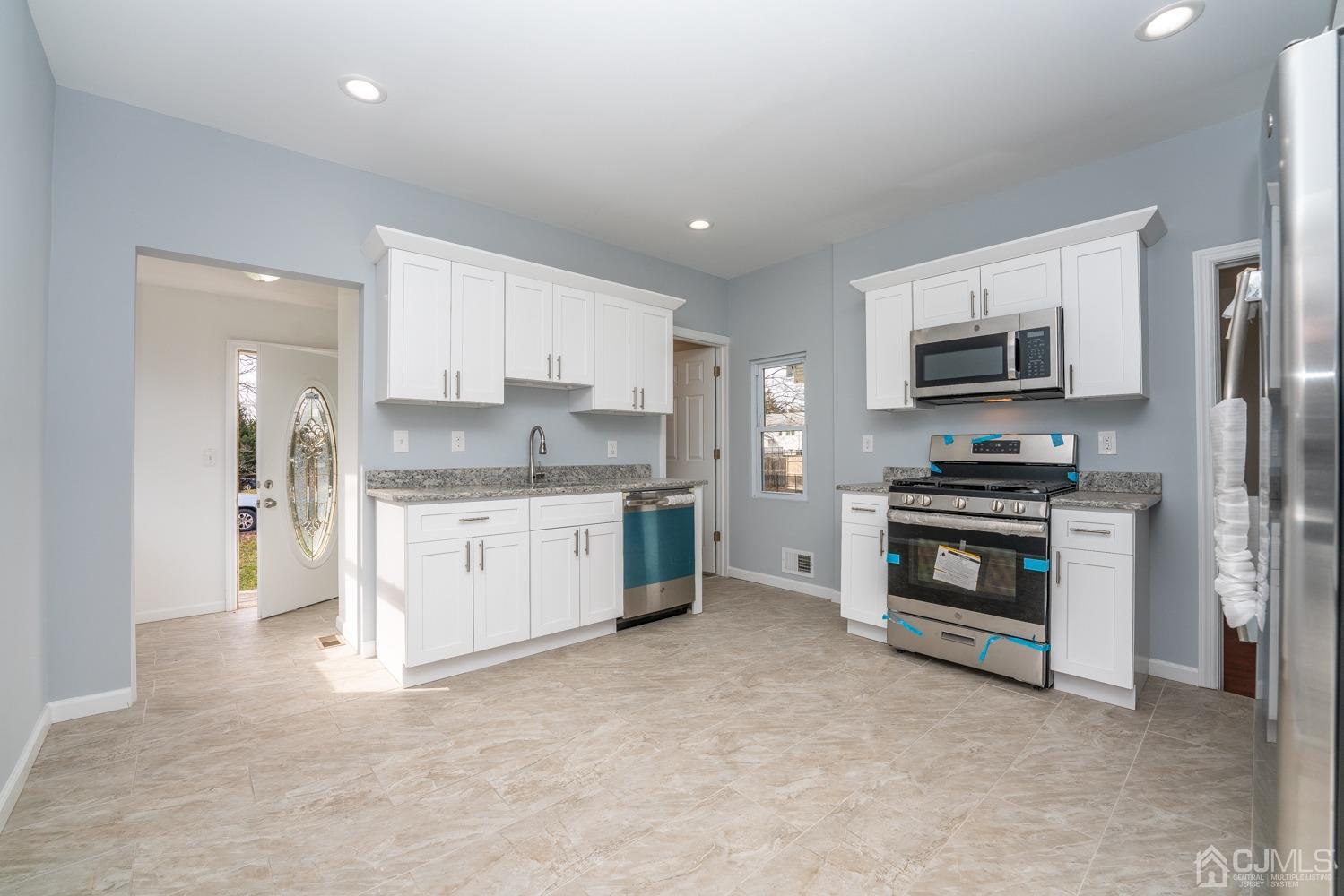42 Meadow Road Edison, NJ 08817 - Photo 9 of 35 a kitchen with a sink and steel stainless steel appliances