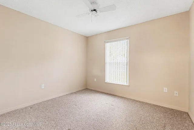 a white bath tub sitting next to a shower