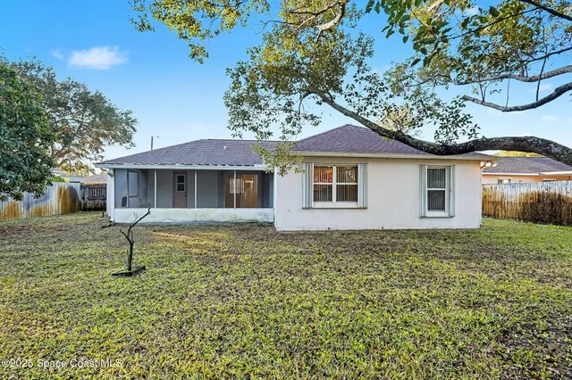 a view of a garden with an outdoor seating