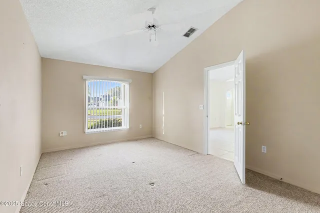 a view of an empty room and window