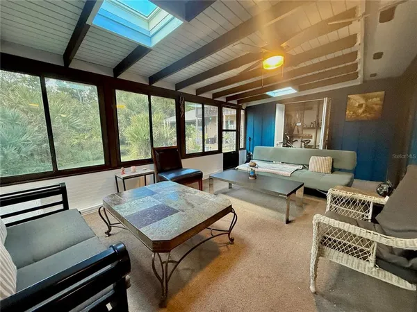 a view of a living room and furniture