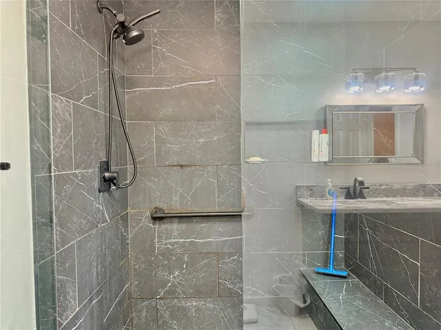 a view of a house with backyard and porch