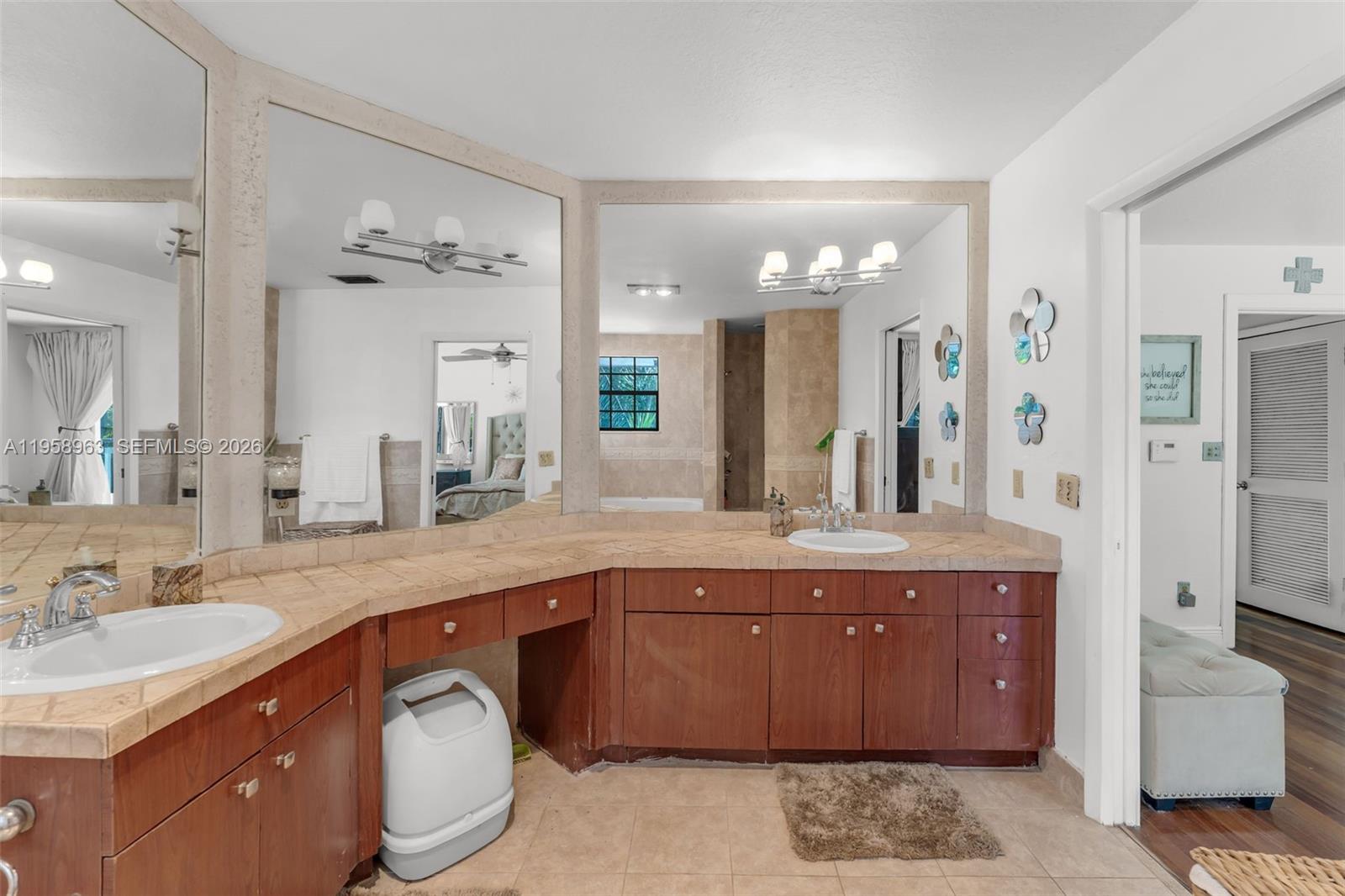 16564 Southwest 153rd Court Miami, FL 33187 - Photo 21 of 45 a spacious bathroom with a granite countertop sink a toilet a mirror and shower