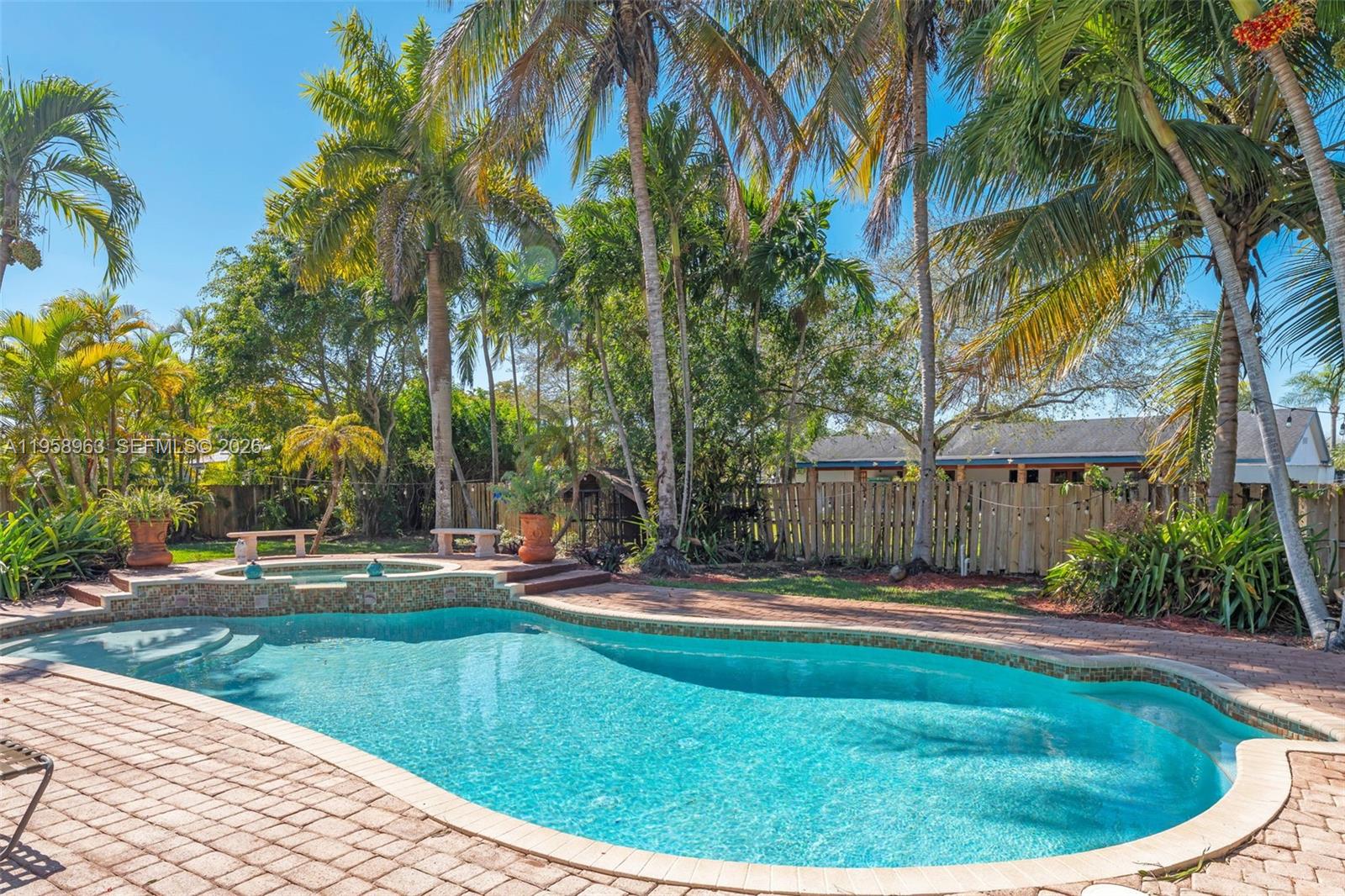 16564 Southwest 153rd Court Miami, FL 33187 - Photo 28 of 45 a view of a backyard with palm trees