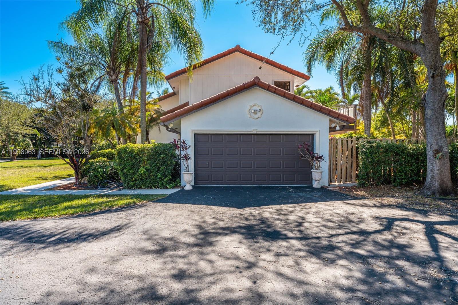16564 Southwest 153rd Court Miami, FL 33187 - Photo 34 of 45 a front view of a house with a yard and garage