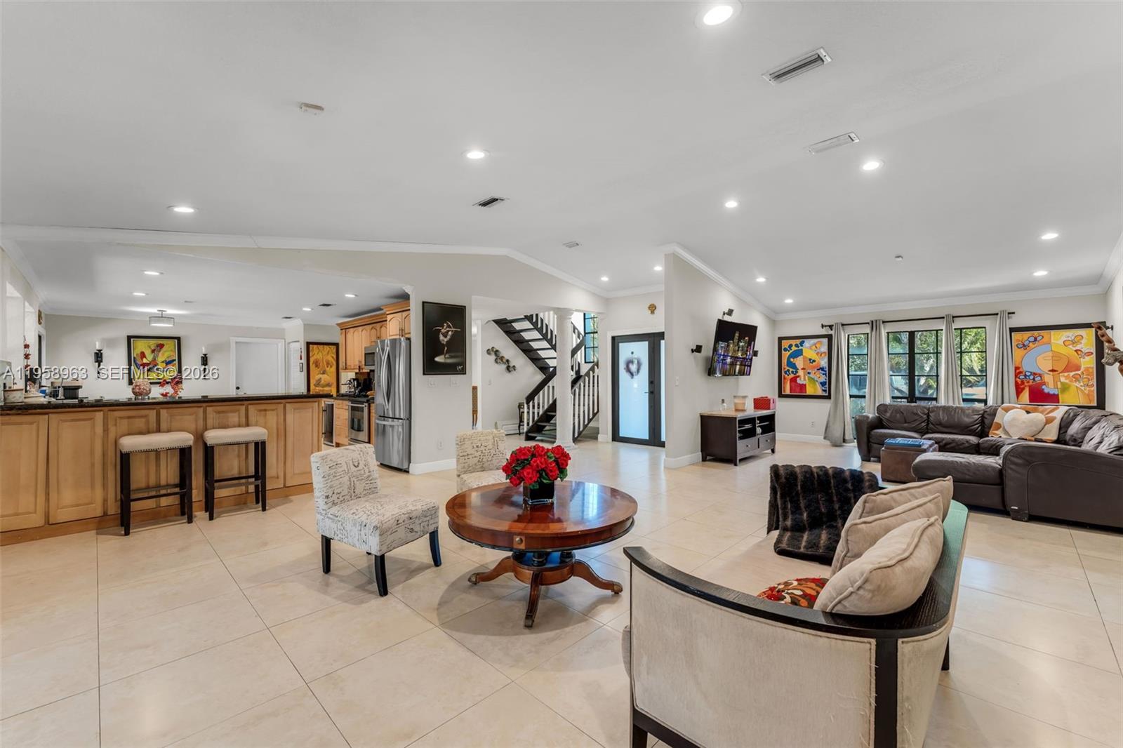 16564 Southwest 153rd Court Miami, FL 33187 - Photo 7 of 45 a living room with furniture and white walls